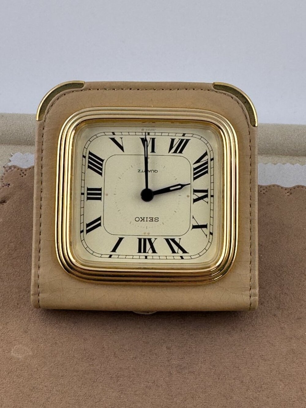 Seiko gold tone travel alarm clock with classic Cream dial and Roman numerals